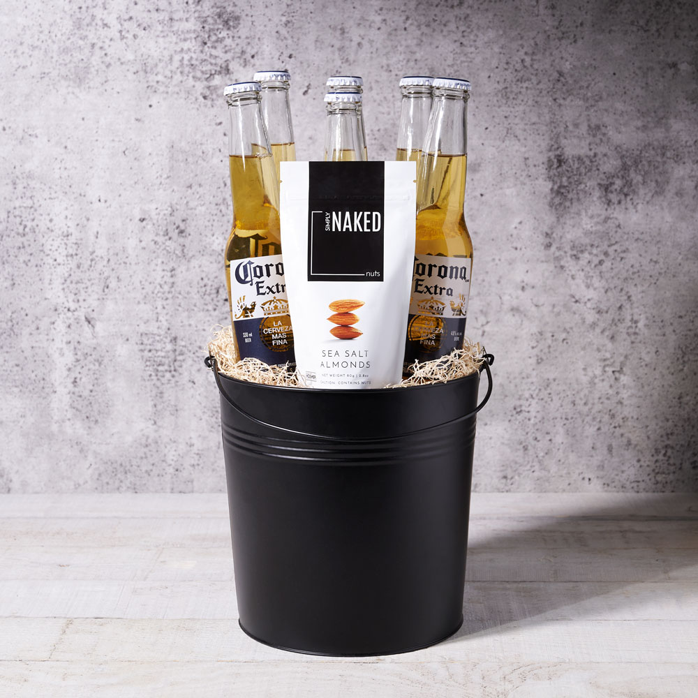 Corona & Sunshine arrives stocked with 6 beers inside a sleek black metal pail, plus a delectable side of sea salted almonds - the perfect gift for any occasion and any friend!
